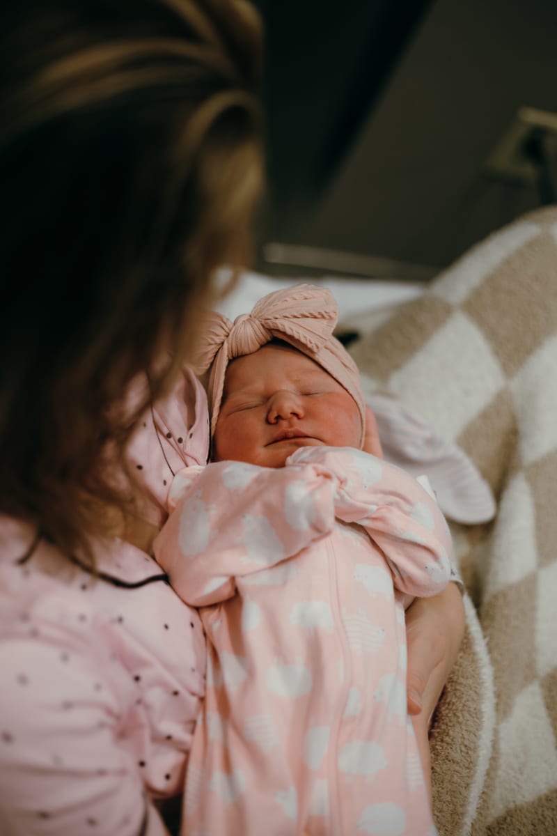 A newborn swaddled in a soft blanket