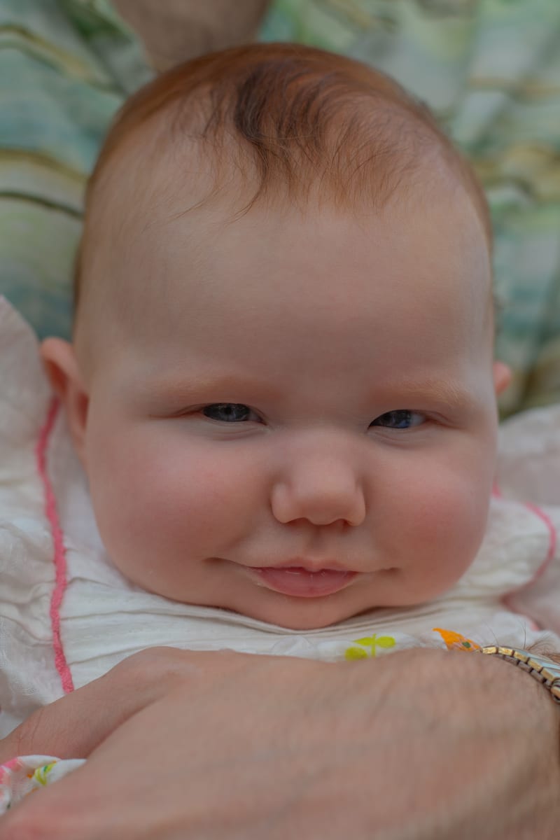 A smiling baby, close up