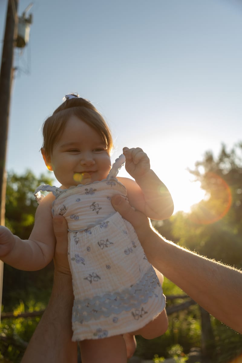 A little girl standing in the sunlight