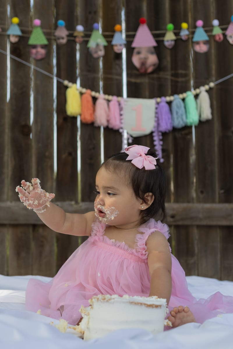 A baby with her first birthday cake