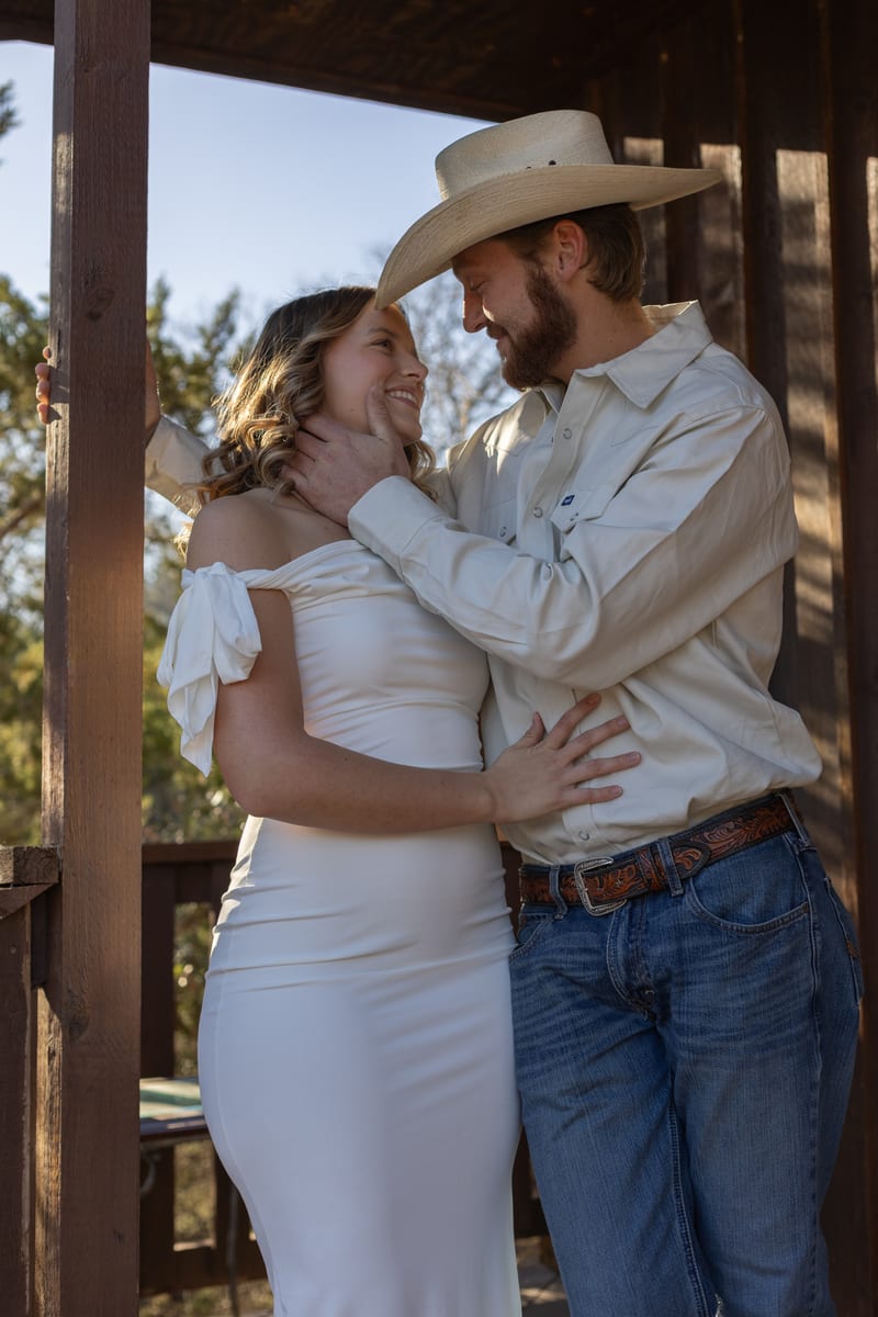 A couple embracing on a porch